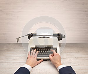 First person perspectve hand writing on an oldschool typewriter