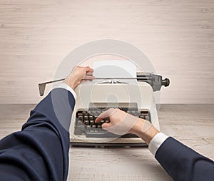 First person perspectve hand writing on an oldschool typewriter