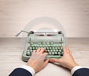 First person perspectve hand writing on an oldschool typewriter