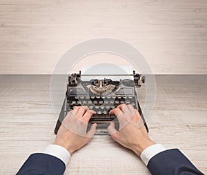 First person perspectve hand writing on an oldschool typewriter