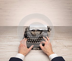 First person perspectve hand writing on an oldschool typewriter