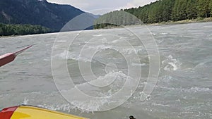 First-person video during an active rafting on the Katun river in Altai. Big waves, splashes, restless river. Sports weekend.