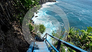 First-person video of a suitable person on an old wooden stairs to a cliff on a high mountain