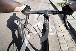 First-person view of cyclist and shadow of cyclist