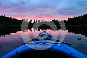 First person view of kayaking in a magical sunset