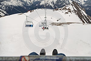 First-person view ski chair lift ropeway at ski resort