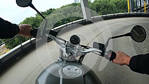First person view of turning on corners on motorbike at the multi-level parking
