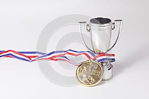 First place gold medal and winners trophy
