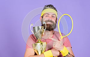 First place. Sport achievement. Tennis champion. Win tennis game. Celebrate victory. Athletic man hold tennis racket and