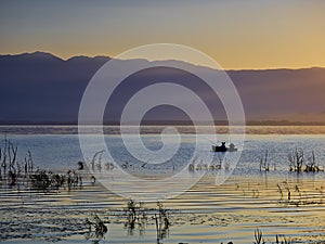 First rays of the sun and fishermen