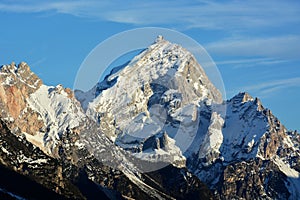 The first snow of autumn on the highest peaks of the mountains