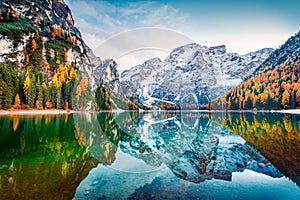 First snow on Braies Lake. Colorful autumn landscape in Italian Alps, Naturpark Fanes-Sennes-Prags, Dolomite, Italy, Europe.