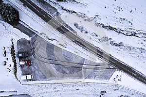 First snow. Cars under snow on a parking after blizzard