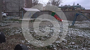 First snow in the courtyard of the provincial Russian city