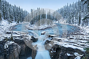 First snow Morning in Jasper National Park Alberta Canada Snow-covered winter landscape in the Sunwapta Falls on Athabasca river.