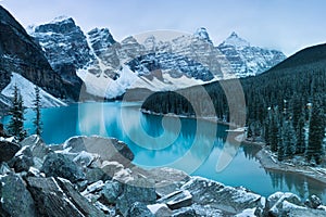 First snow Morning at Moraine Lake in Banff National Park Alberta Canada Snow-covered winter mountain lake in a winter atmosphere.