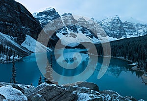 First snow Morning at Moraine Lake in Banff National Park Alberta Canada Snow-covered winter mountain lake in a winter atmosphere.