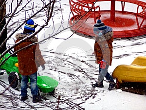 First snow at the playground in yellow, green and red