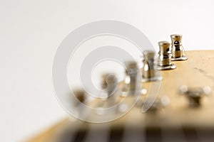 first string electric guitar tuners isolated white background