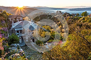 First sun rays on the picturesque village of Vitsa in Zagori area, Northern Greece