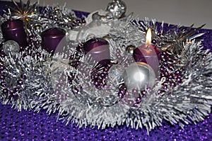 First sunday in advent concept xmas light with candles ball bauble stars.Studio shot of a nice advent wreath with baubles and burn