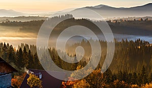 First sunrise rays of sun in Carpathian mountains.