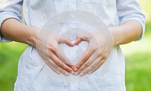 First trimester of pregnancy, love sign photo