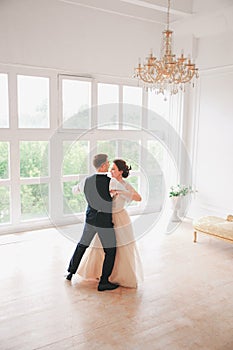 First wedding danc.wedding couple dances on the studio. Wedding day. Happy young bride and groom on their wedding day.