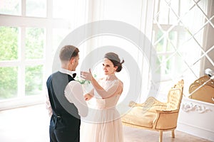 First wedding danc.wedding couple dances on the studio. Wedding day. Happy young bride and groom on their wedding day.