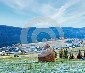 First winter snow and autumn mountain village