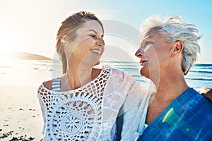 First you were my mom...now youre my best friend. a senior woman and her adult daughter spending a day at the beach.