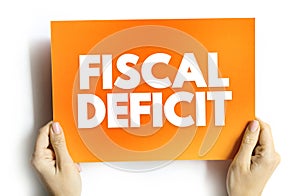 Fiscal Deficit is a shortfall in a government\'s income compared with its spending, text concept on card
