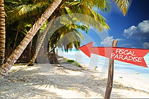 Fiscal paradise with red arrow on tropical island photo