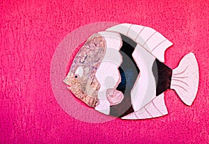 fish art made of pisp on the wall