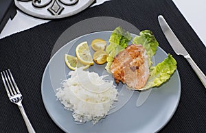 Fish atlantic salmon with salad and grated radish.