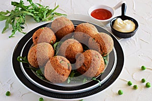 Fish balls with tuna and green peas