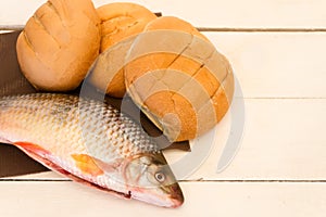 Fish and breads on white background