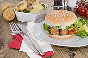 Fish Burger with fried Potatoes in a bowl