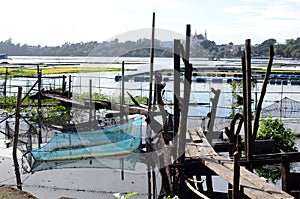 Fish cage and bamboo raft are common scenes environmental issues that destroy lake