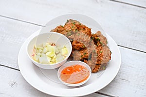 Fish cakes on white plate , fried fish paste balls with sauce - Asian Thai food