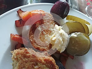 Fish cakes with yam fries and pickles  restaurant dining setting at an elegant table for dinner