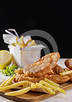 fish chips chopping board with lemon copy space. High quality photo