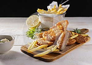 Fish chips chopping board with lemon. High quality and resolution beautiful photo concept