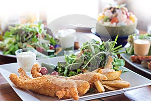 fish and chips Deep fried battered fish on a plate with chips cl