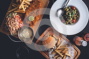 Fish and Chips, Fries and Burger, Pasta Dish on Restaurant Table