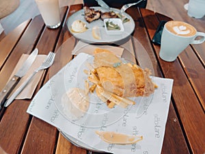 Fish and chips on the plate at the Koffie Lake cafe