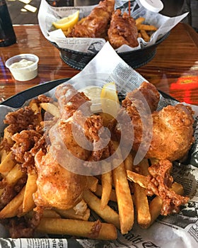 Fish and Chips Served Pub Style in tissue lined baskets.