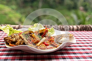 Fish cooked with spicy sauce photo