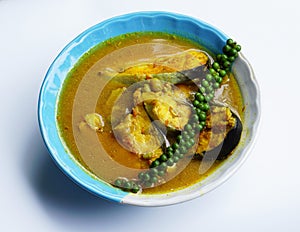 Fish curry with turmeric yellow peppers