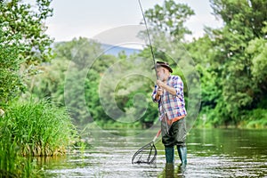 Fish or cut bait. hobby and sport activity. pothunter. retired bearded fisher. Trout bait. fisherman with fishing rod